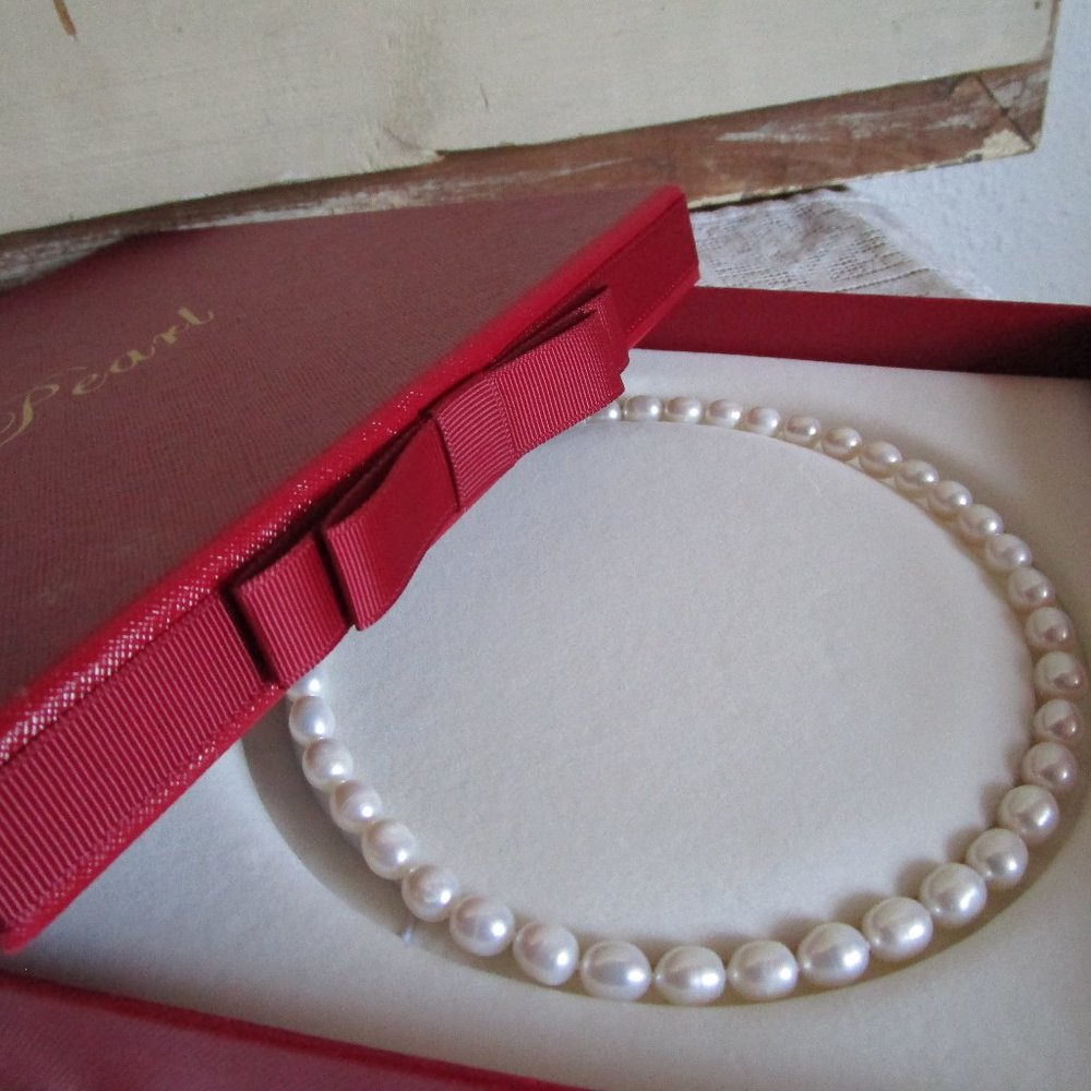 16" Chinese pearls, new condition. Baroque style high sheen, original box